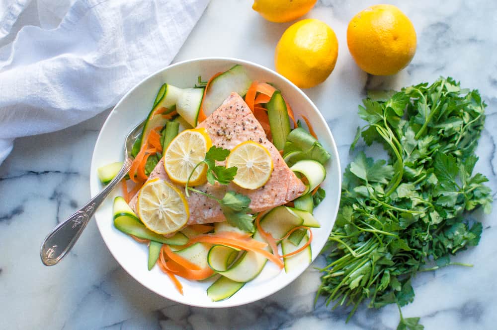 Instant Pot lemon garlic salmon served with vegetables and a metal fork on the side