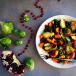 Warm Kale Salad with Pomegranate and Garlic Roasted Brussels Sprouts and Sweet Potatoes