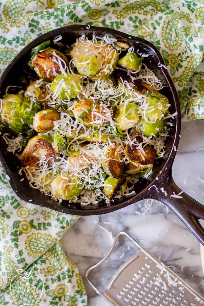 Pan-Roasted Brussel Sprouts with Brown Butter Parmesan served in a skillet
