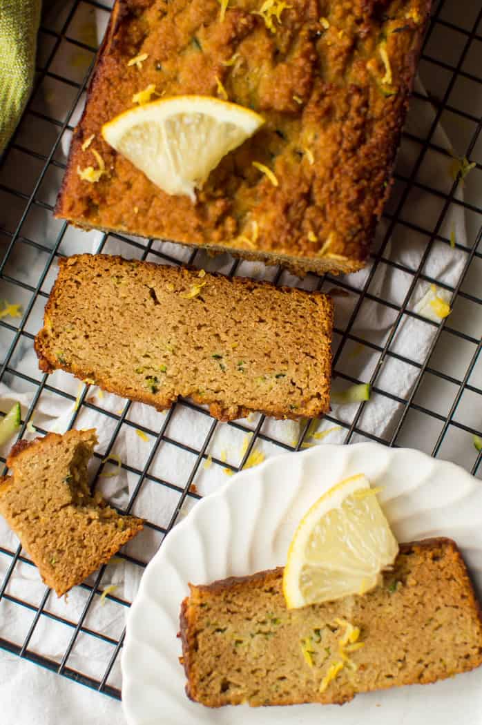 This Paleo lemon zucchini bread is perfectly moist, packed with zucchini and the perfect balance of sweet and tangy! Gluten free, dairy free, nut free option and naturally sweetened- this is one bread everyone will rave about!