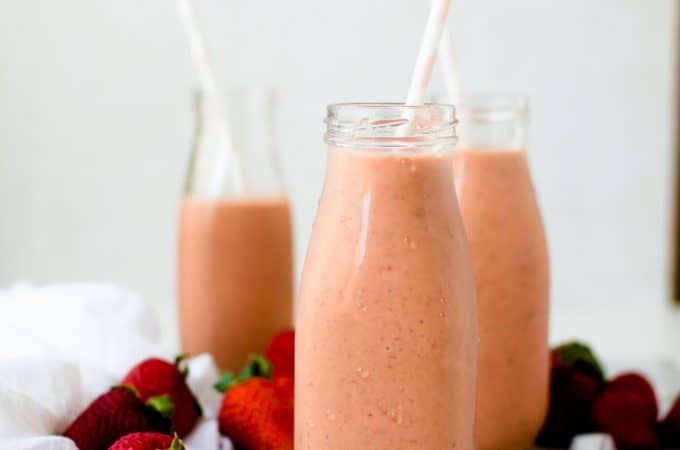 smoothies in milk bottles with straws