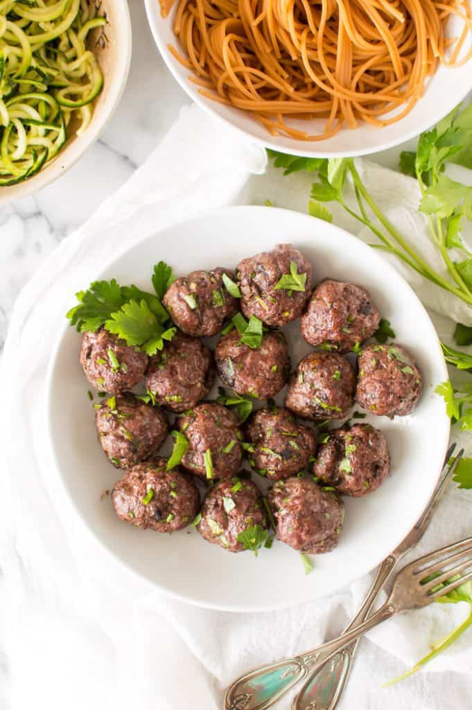 Beef and mushroom meatballs on a white plate - a great example of one of the healthy meatballs recipes