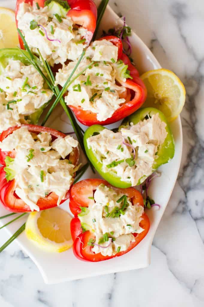 These Lemon Garlic Chicken Stuffed Peppers are easy, loaded with flavor, and are so delicious! A simple healthy no-cook meal for summer and are Paleo, Whole30 and gluten free!