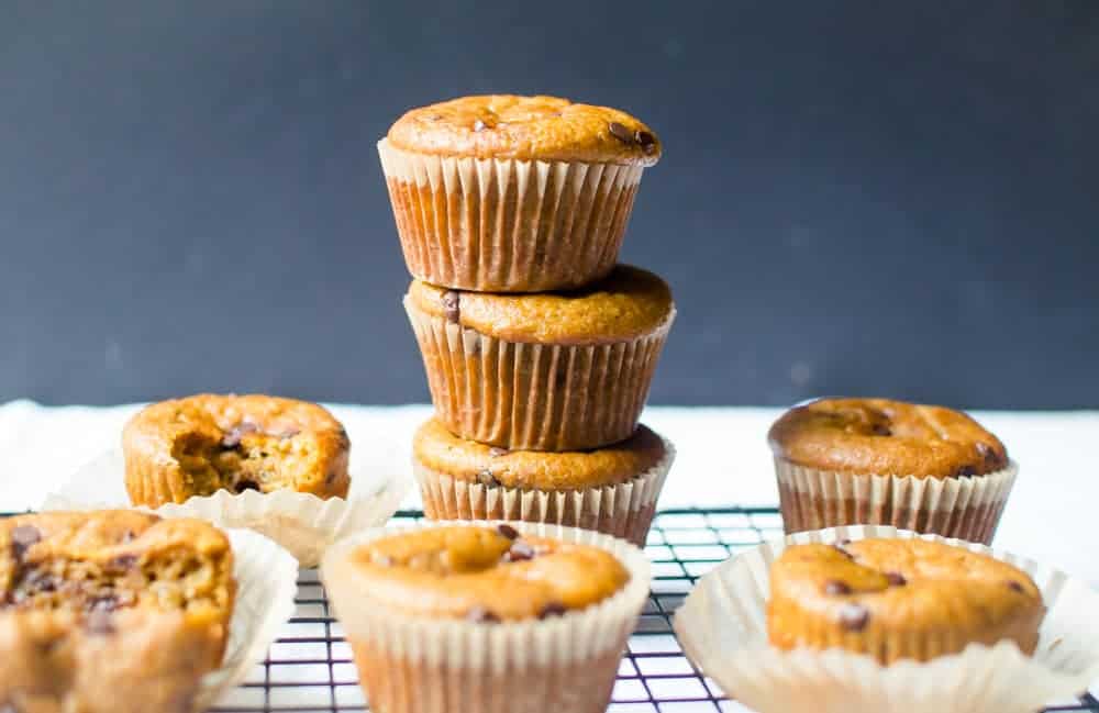 Pumpkin muffins stacked on cooling rack