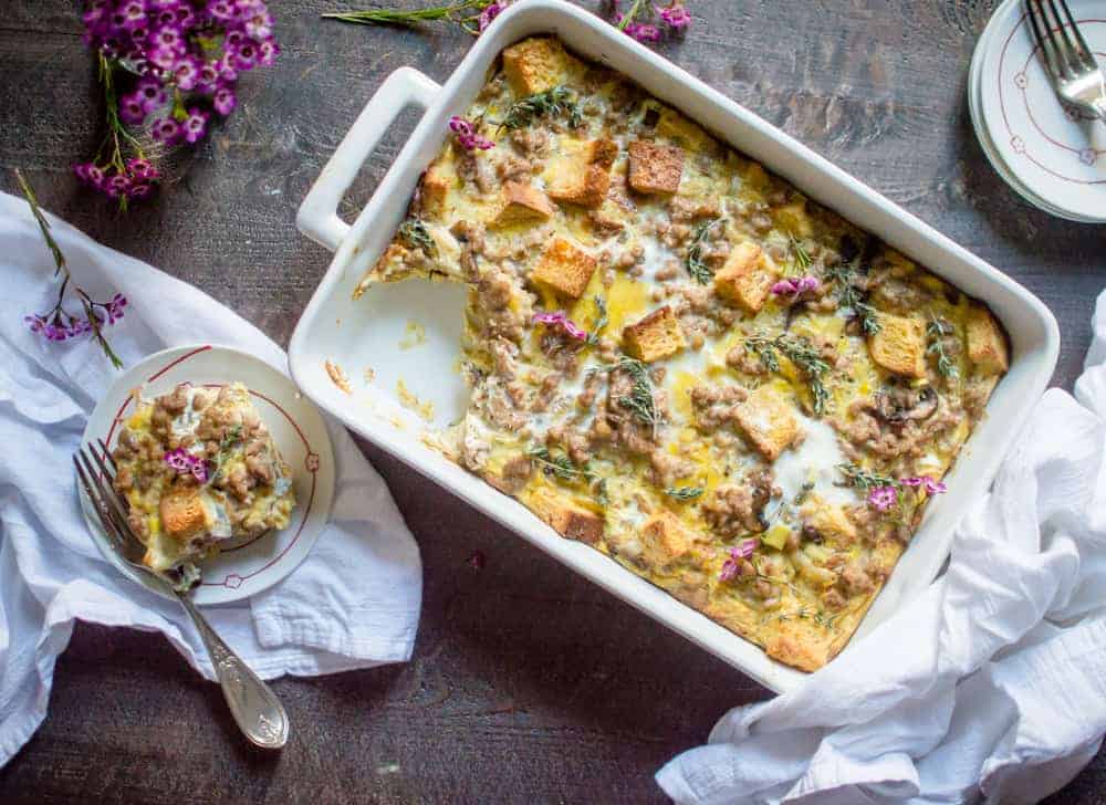Overhead on the Sausage Leek & Mushroom Breakfast Casserole served in a pan and a small plate.