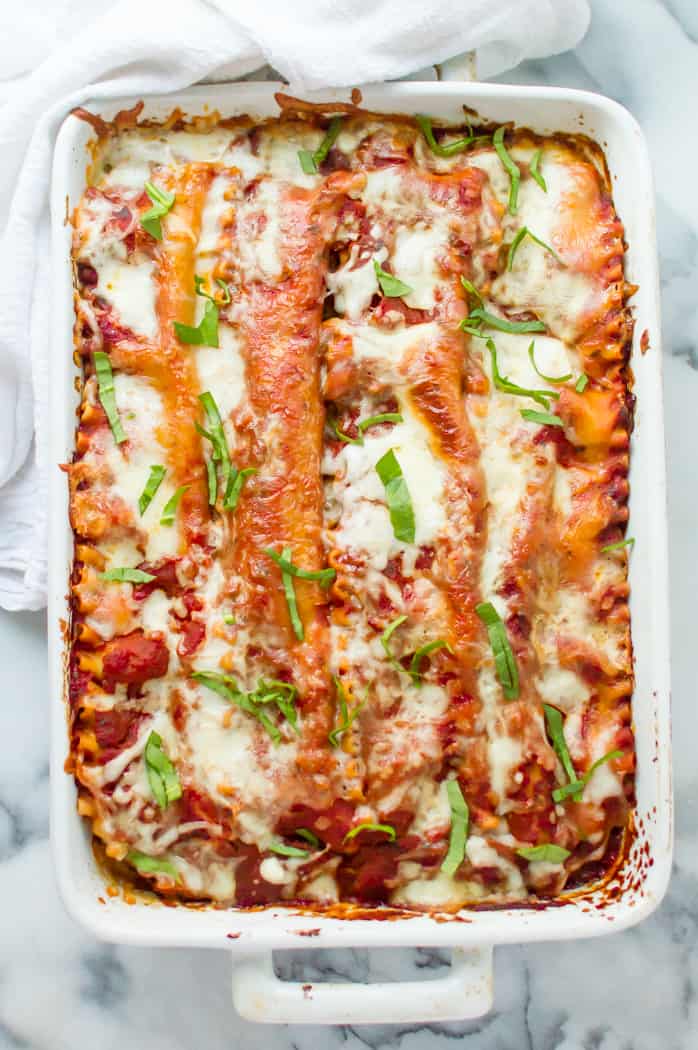 Baked turkey veggie-loaded lasagna on a marble table with a white napkin