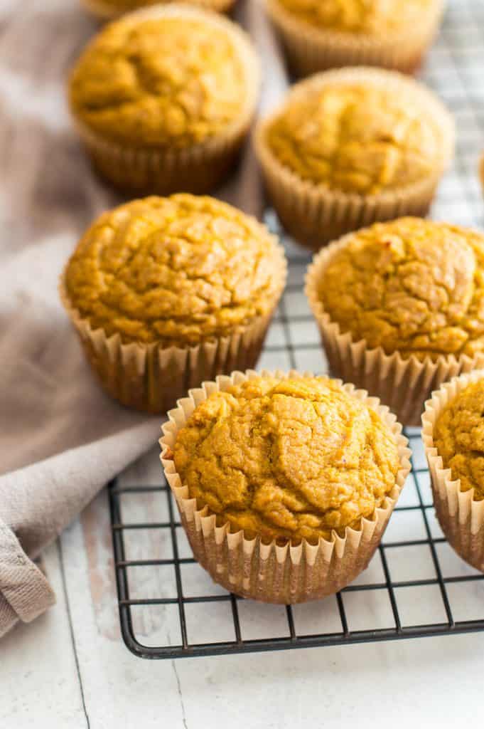 Pumpkin protein muffins on a cooking rack.