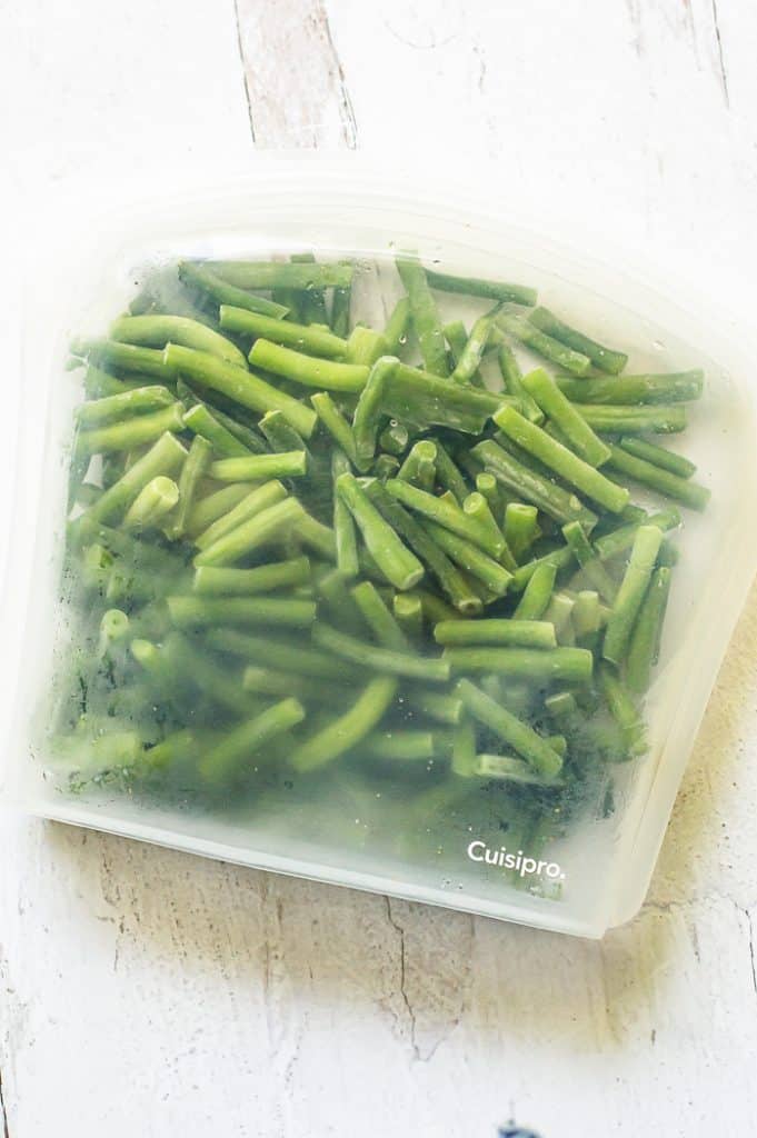 Frozen green beans in a large silicone bag.