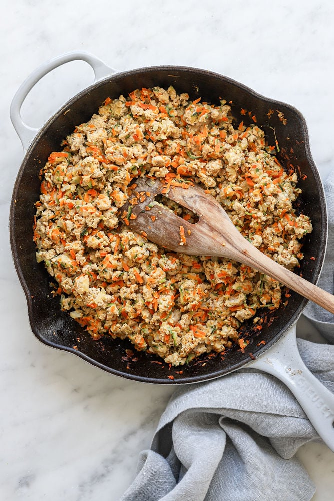 The turkey veggie mixture for sloppy joes in a skillet with wooden spoon before sauce is added.
