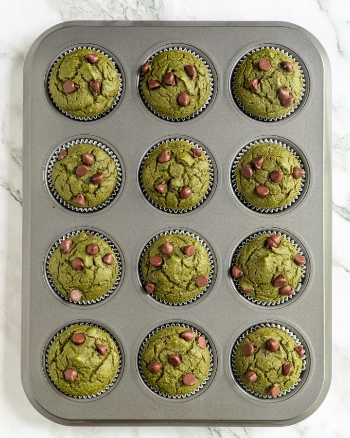 Sweet kale muffins in a muffin tin after baking.
