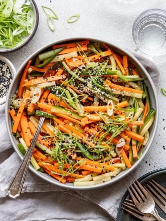 Crunchy Cucumber Carrot Salad with Sesame Dressing served in a bowl