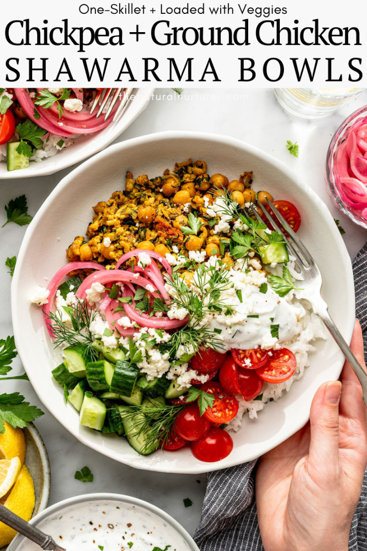 A bowl filled with ground chicken, chickpeas, rice, cherry tomatoes, cucumber, pickled onions, fresh herbs, and a dollop of yogurt sauce. A hand holds the fork. Text above reads Chicken Shawarma Bowls for a vibrant meal.